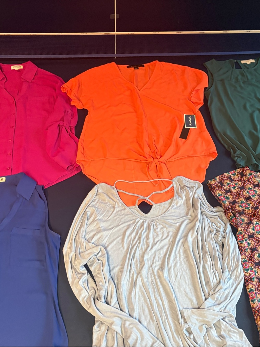 6 assorted women’s size small dress shirts.